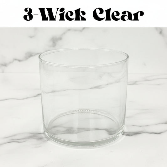 Clear glass candle holder on a marble background with text '3-Wick Clear'.